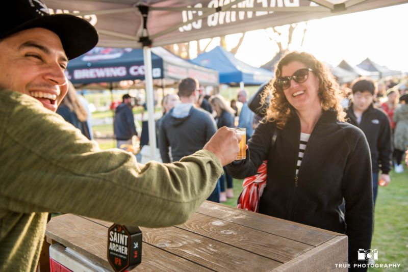 St. Archer Brewing Company brewer interacts with event goers at craft beer booth