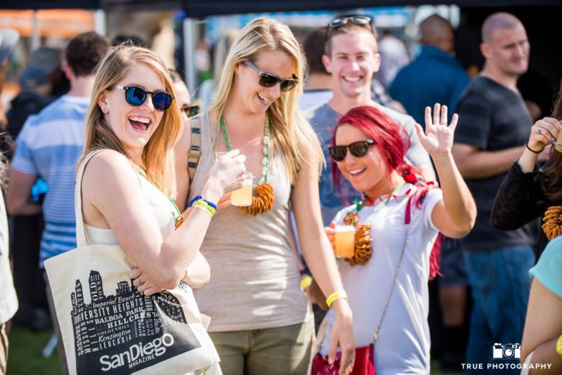 Group of girls smile and pose for group photo during Best Coast Beer Fest