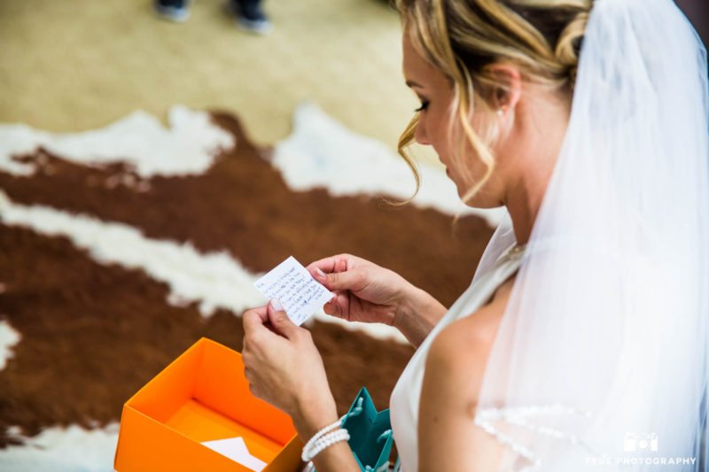 Bride reading card from Groom