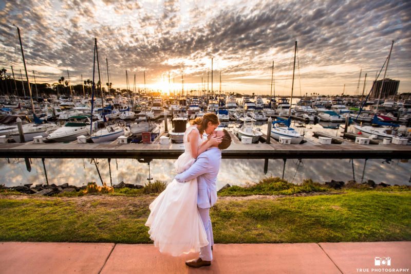 Candid photo of a wedding couple at sunset