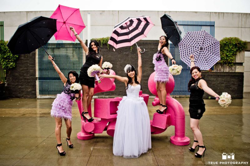 A bride poses with her fashionable bridesmaids.