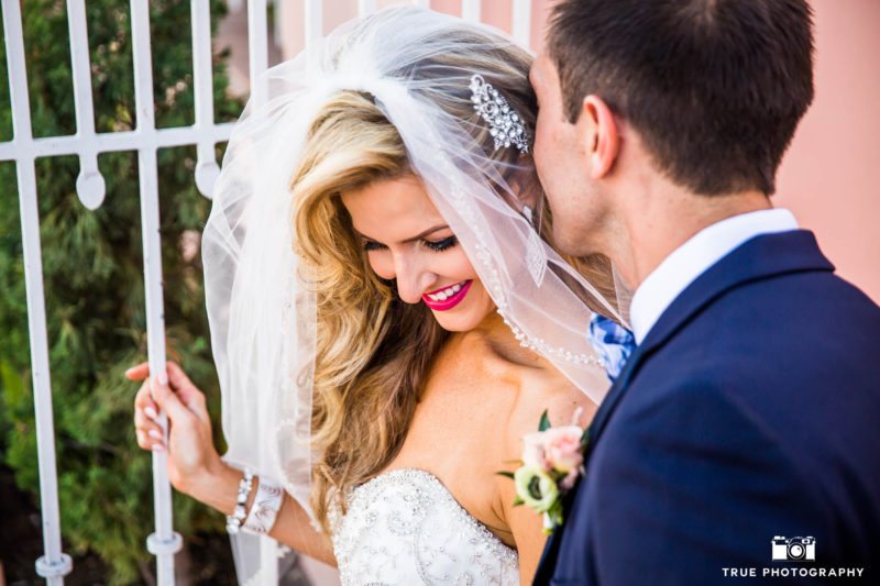 Bride candidly laughs with groom on wedding day