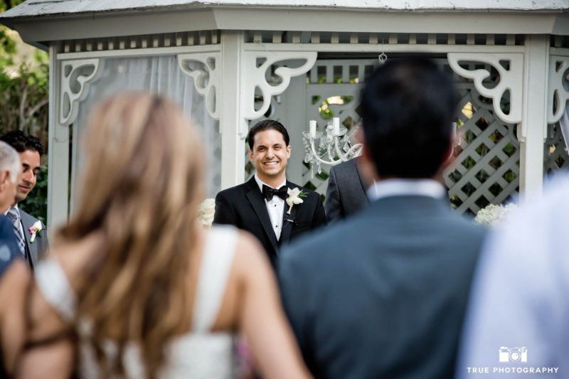 Groom's reaction to Bride at wedding ceremony
