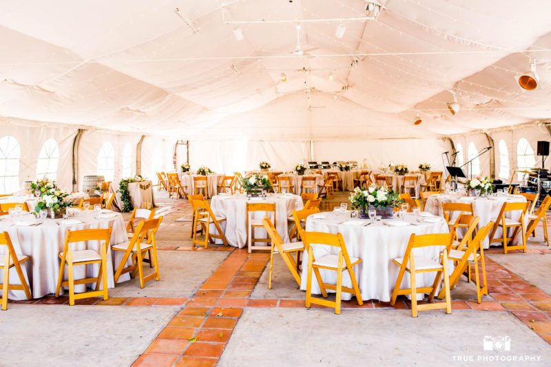 Tented rustic wedding reception at vineyard