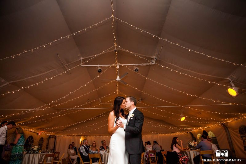 Bride and Groom share kiss during dance