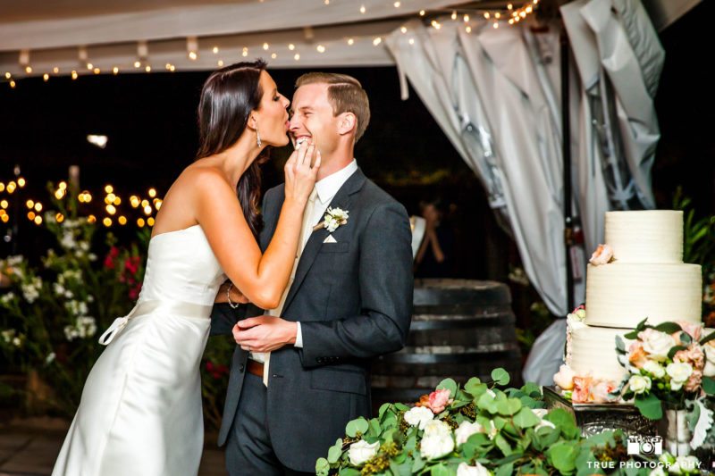 Bride smashes wedding cake into groom nose