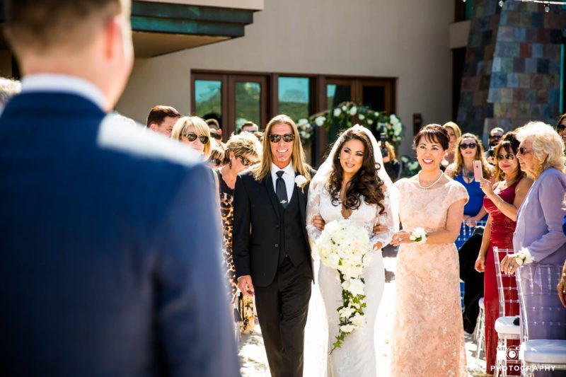 Bride's reaction as she walks down aisle during wedding ceremony