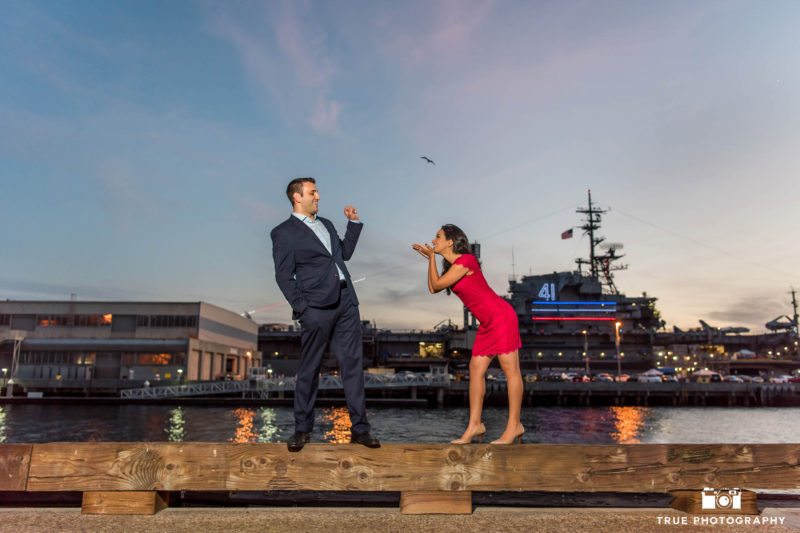 Night engagement session at Broadway Pier with USS Midway in Background