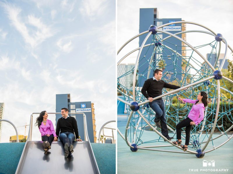 Future bride and groom on jungle gym during fun engagement session at Waterfront Park
