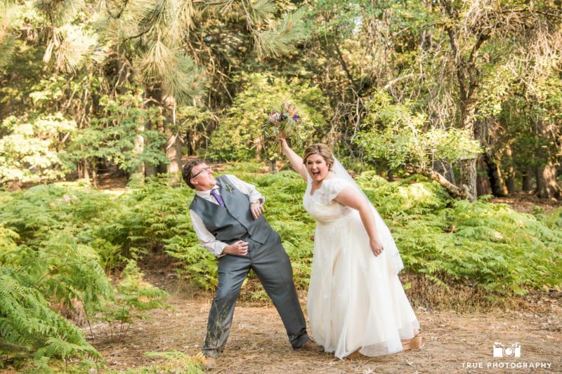 Bride pretends to hit groom with bouquet