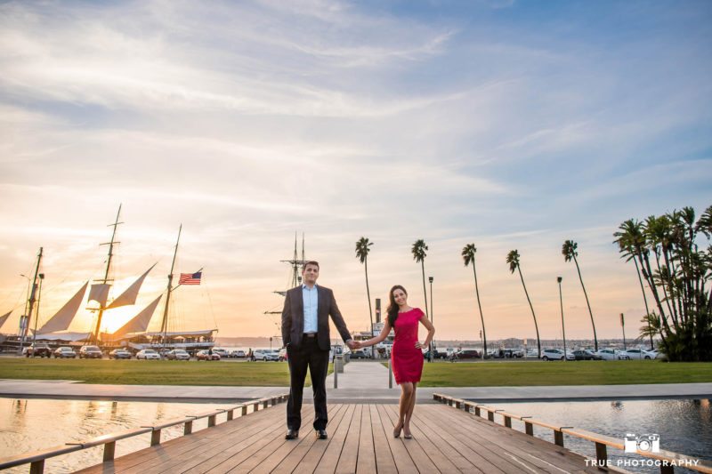 Future bride and groom holding hands during stylish engagement session in Downtown Waterfront Park