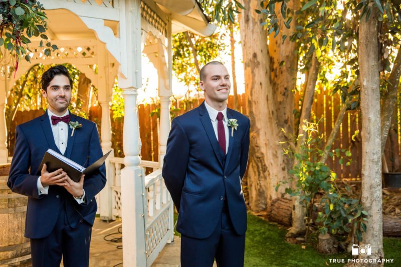 Groom's candid reaction to seeing bride at wedding ceremony