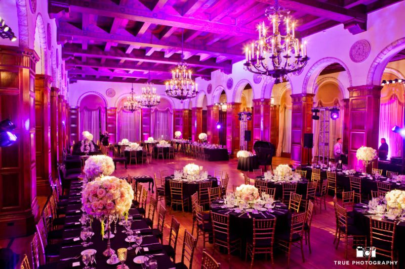 Overall shot of a brightly lit purple reception room.