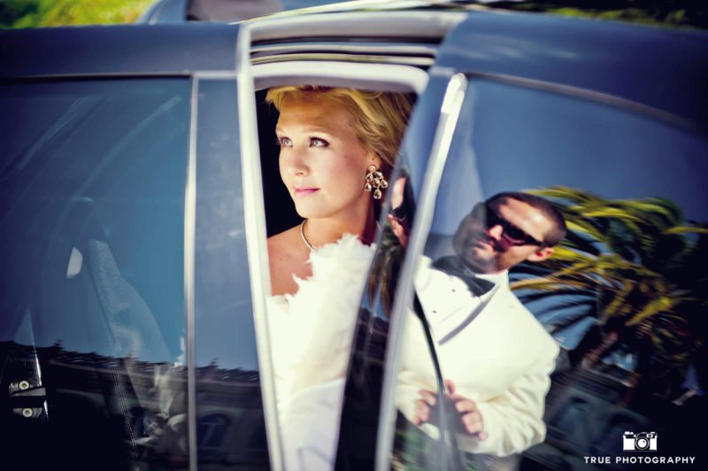 Reflection of groom in limo window