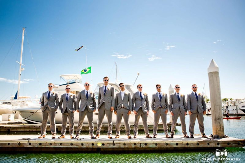 Groomsmen with gray suits and blue ties.