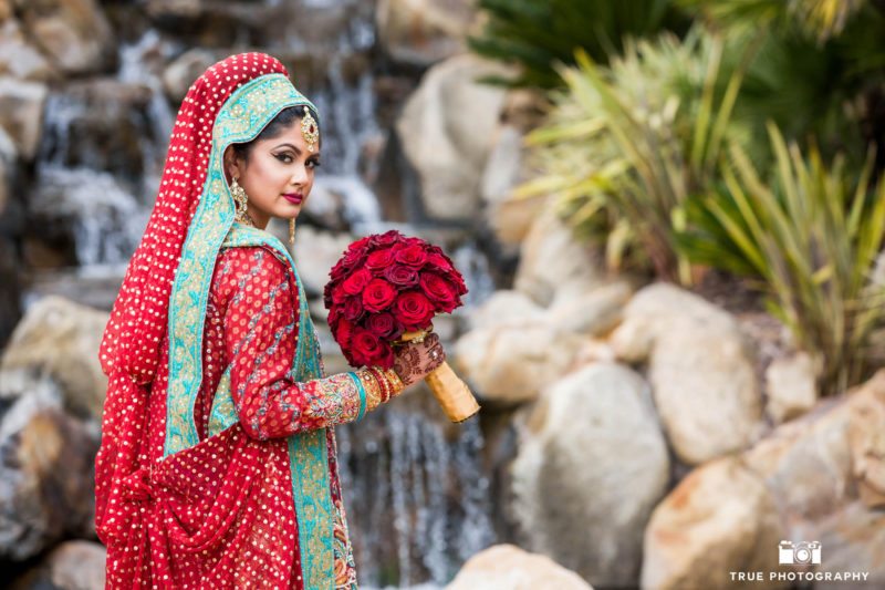 Beautiful Indian Bride by the waterfall