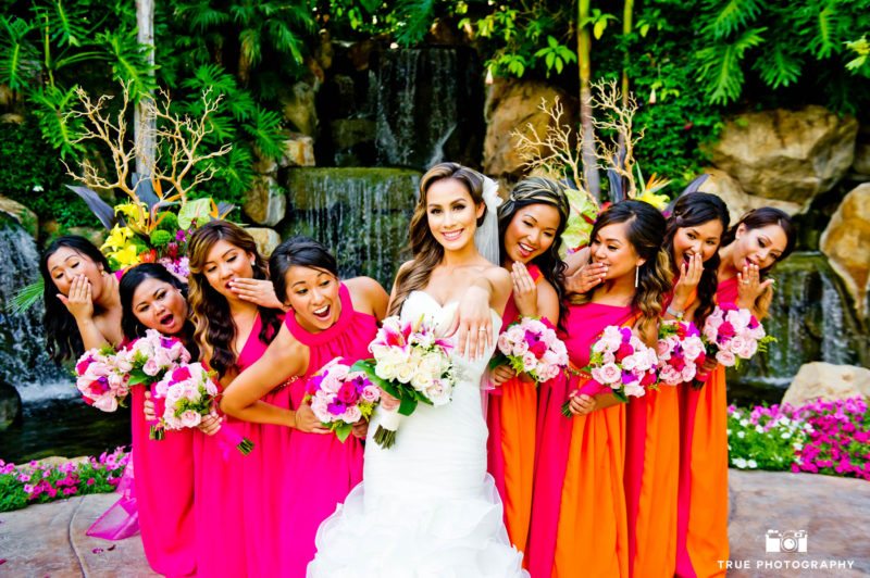 Bride shows off her ring to her bridesmaids