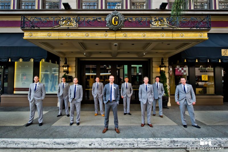 Groomsmen standing outside the US Grant Hotel in Downtown San Diego