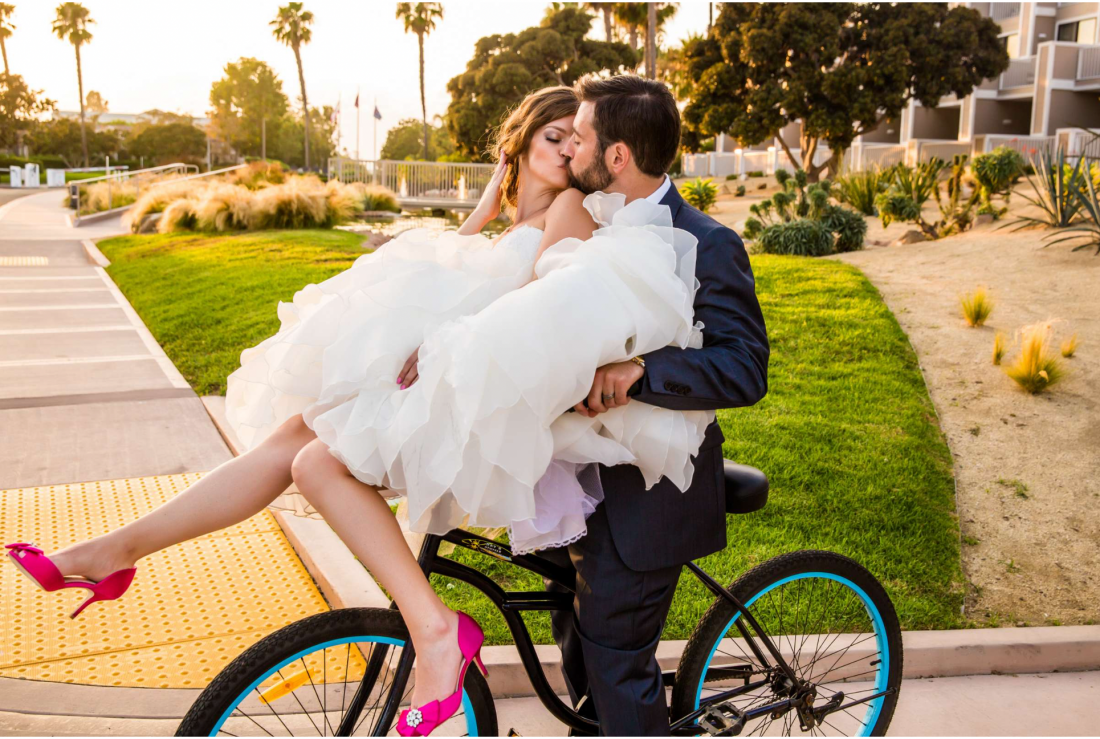 Wedding couple on bicycle photographed by True Photography