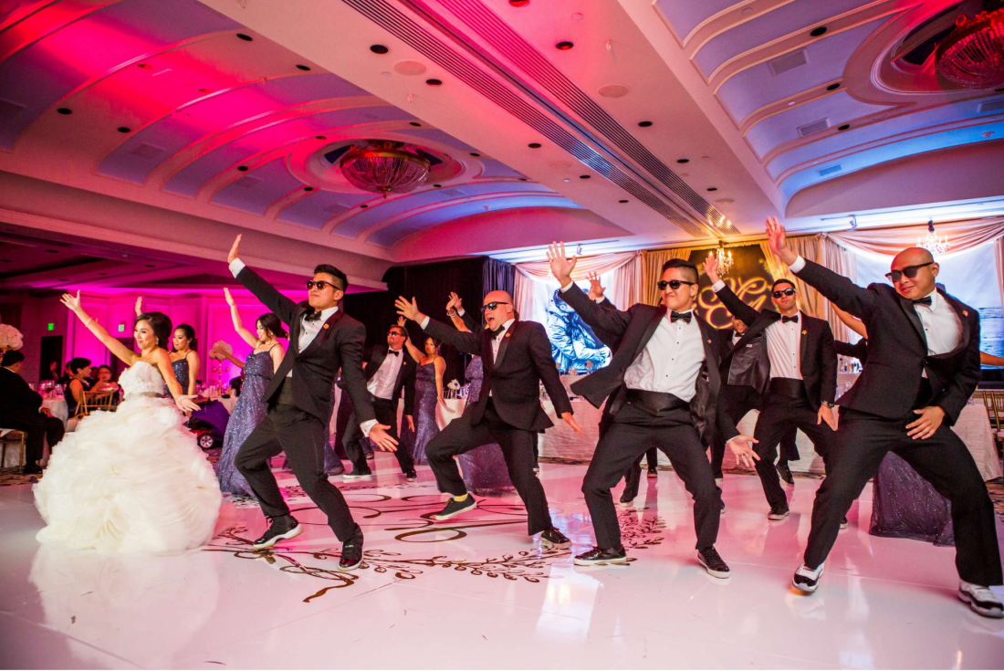 Candid group dance at wedding reception photographed by True Photography
