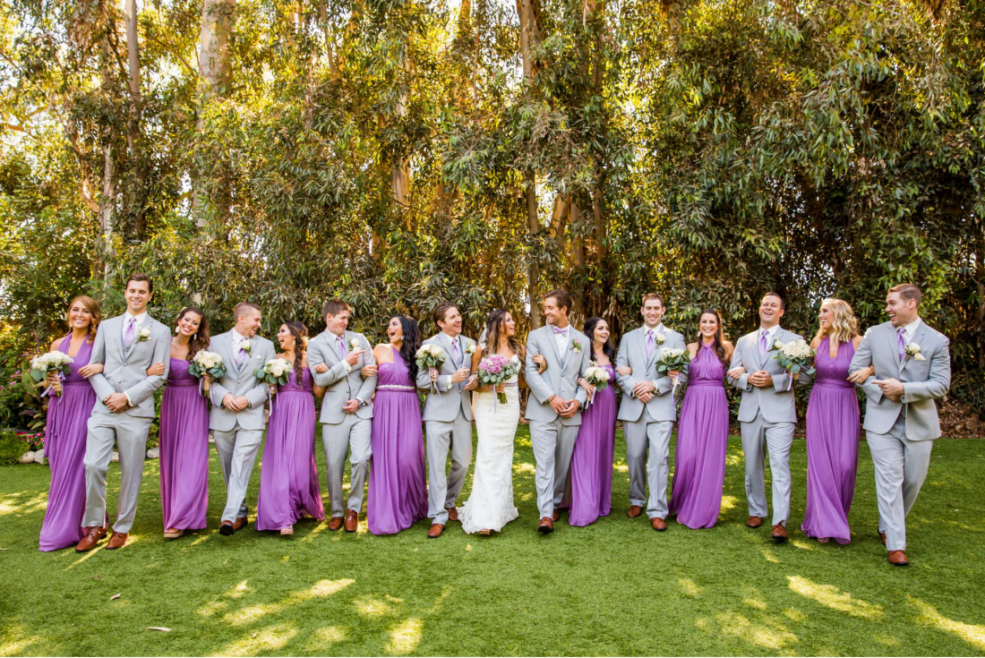 Purple coordinated bridal party photographed by True Photography