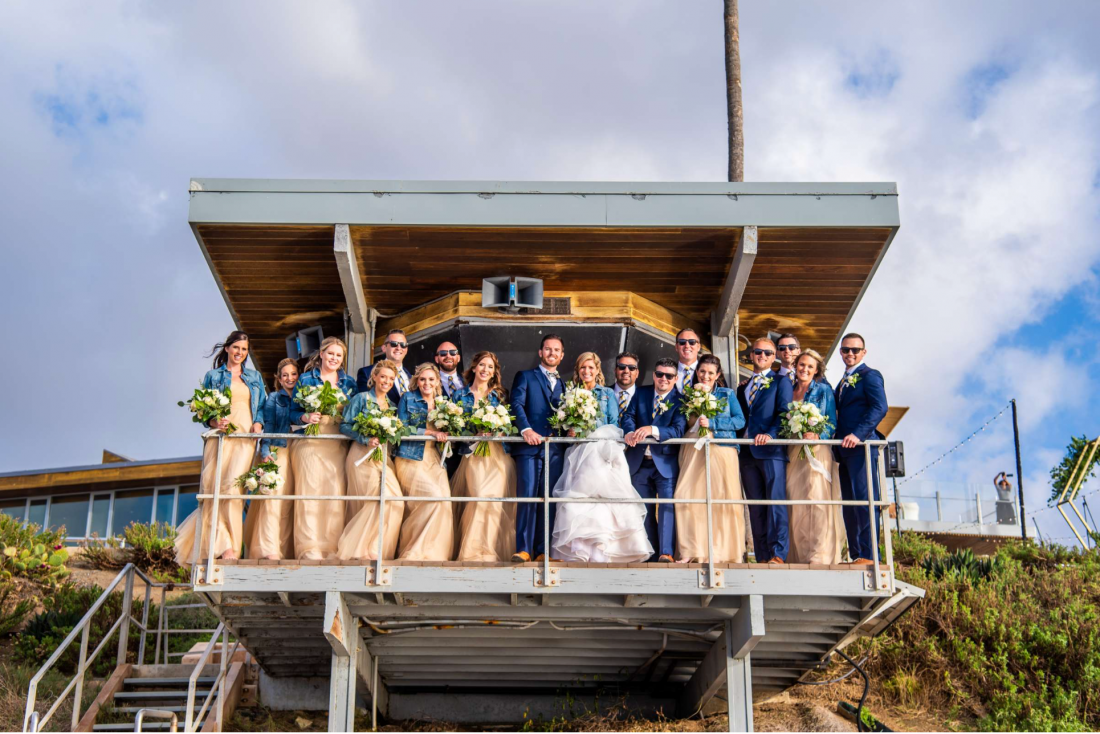 Bridal party on the lifeguard tower at Scripps Seaside Forum photographed by True Photography